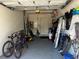 Spacious two car garage with ample storage and bikes create an ideal space for DIY and auto enthusiasts at 4062 Overture Cir # 4062, Bradenton, FL 34209
