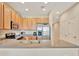 Bright kitchen with ample counter space, stainless steel appliances, and light wood cabinetry at 4062 Overture Cir # 4062, Bradenton, FL 34209