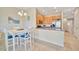 Bright kitchen and dining area with stainless steel appliances and tile flooring at 4062 Overture Cir # 4062, Bradenton, FL 34209
