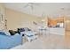 Comfortable living space with sofa, table, and bar stools leading to the stainless steel kitchen appliances at 4062 Overture Cir # 4062, Bradenton, FL 34209