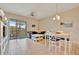 Bright living room with sliding glass doors to a screened balcony overlooking tropical foliage at 4062 Overture Cir # 4062, Bradenton, FL 34209