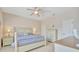 Calm main bedroom with neutral walls, ceiling fan, and light-colored wood furniture at 4062 Overture Cir # 4062, Bradenton, FL 34209
