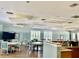 The building has a bright and inviting meeting space with plenty of tables and chairs at 4062 Overture Cir # 4062, Bradenton, FL 34209