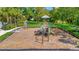 A fun and inviting playground area with modern equipment, set in a lush green space at 4062 Overture Cir # 4062, Bradenton, FL 34209
