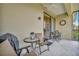 Spacious screened balcony with outdoor seating area and neighborhood views at 4062 Overture Cir # 4062, Bradenton, FL 34209