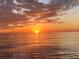 Serene water sunset featuring a beautiful, vibrant sky reflecting off the calm water at 4062 Overture Cir # 4062, Bradenton, FL 34209