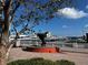 Picturesque waterfront featuring an aquatic statue, a well-maintained park, and luxury boats at 4062 Overture Cir # 4062, Bradenton, FL 34209