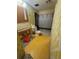Outdated bathroom with yellow wallpaper and flooring in need of renovation at 7321 Central Ave # 504, St Petersburg, FL 33710