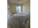 Empty bedroom showing the need for renovation, with a sliding glass door to the outside at 7321 Central Ave # 504, St Petersburg, FL 33710
