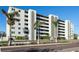 Six-story condo building exterior featuring balconies and palm trees at 7321 Central Ave # 504, St Petersburg, FL 33710