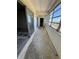 Empty hallway with large windows and sliding glass door that needs some work at 7321 Central Ave # 504, St Petersburg, FL 33710