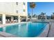 Beautiful outdoor pool with clear blue water, surrounded by lounge chairs and lush landscaping at 7321 Central Ave # 504, St Petersburg, FL 33710