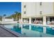 Inviting outdoor pool with lounge seating and a spacious deck area under a sunny blue sky at 7321 Central Ave # 504, St Petersburg, FL 33710