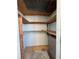Small storage room with wooden shelves at 7321 Central Ave # 504, St Petersburg, FL 33710