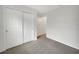 Neutral bedroom with carpet flooring, closet with sliding doors and connecting doors at 11510 Southern Creek Dr, Gibsonton, FL 33534