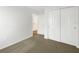 Neutral bedroom featuring carpet flooring and closet with sliding doors at 11510 Southern Creek Dr, Gibsonton, FL 33534
