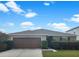 Charming single-story home with a well-manicured front yard and a spacious two-car garage, perfect for suburban living at 11510 Southern Creek Dr, Gibsonton, FL 33534