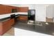 Well-equipped kitchen featuring sleek black appliances, ample cabinet space, and a convenient breakfast bar for casual dining at 11510 Southern Creek Dr, Gibsonton, FL 33534