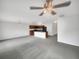 Spacious living area with modern gray carpet and an open layout flowing into the kitchen, ideal for entertaining at 11510 Southern Creek Dr, Gibsonton, FL 33534