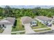 Well-maintained houses, manicured lawns, and mature trees create a serene neighborhood atmosphere from above at 12387 Eastpointe Dr, Dade City, FL 33525