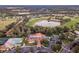 Breathtaking aerial view of the community with a sparkling lake, golf course, pool, and beautiful clubhouse at 12387 Eastpointe Dr, Dade City, FL 33525