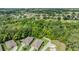 Aerial view showcasing homes near a lush green space or golf course, highlighting community amenities and landscaping at 12387 Eastpointe Dr, Dade City, FL 33525