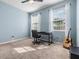 Bedroom with a desk, chair, and two windows providing ample workspace and natural light at 12387 Eastpointe Dr, Dade City, FL 33525