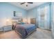 Bright bedroom featuring a comfortable bed, stylish furniture, soft carpet, and natural light from the windows at 12387 Eastpointe Dr, Dade City, FL 33525