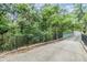 Scenic walking bridge surrounded by lush greenery, offers a peaceful and nature-filled experience at 12387 Eastpointe Dr, Dade City, FL 33525
