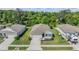 Well-maintained home with a landscaped yard and an attached two-car garage in a residential neighborhood at 12387 Eastpointe Dr, Dade City, FL 33525