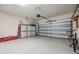 Spacious two car garage with epoxy floors, storage cabinets and automated door at 12387 Eastpointe Dr, Dade City, FL 33525