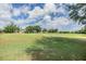 Expansive golf course with manicured greens and a sand trap, ideal for golf enthusiasts and outdoor recreation at 12387 Eastpointe Dr, Dade City, FL 33525