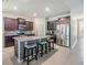 Bright kitchen showcasing a granite island, stainless steel appliances, and seating at the breakfast bar at 12387 Eastpointe Dr, Dade City, FL 33525