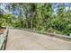 Well-maintained walking path offers a serene and inviting space for leisurely strolls amidst lush greenery at 12387 Eastpointe Dr, Dade City, FL 33525
