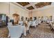 Elegant dining area featuring neutral color scheme, stylish chandelier, and seating for various-sized parties at 12387 Eastpointe Dr, Dade City, FL 33525