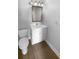 Clean bathroom featuring a white vanity, modern fixtures, and wood floors, offering a fresh and stylish space at 1857 Clearbrooke Dr, Clearwater, FL 33760