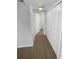 Hallway featuring wood flooring and a closet at 1857 Clearbrooke Dr, Clearwater, FL 33760