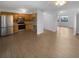 Open-concept kitchen with stainless steel appliances, wood cabinetry, and seamless flow to the dining area at 1857 Clearbrooke Dr, Clearwater, FL 33760