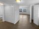 View of the open-concept living room with new laminate floors and natural light at 1857 Clearbrooke Dr, Clearwater, FL 33760
