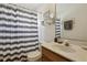 Bathroom featuring a single vanity with a tiled shower and tub at 13405 Fawn Springs Dr, Tampa, FL 33626