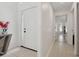 Inviting entryway featuring neutral tile floors and a white front door at 13405 Fawn Springs Dr, Tampa, FL 33626