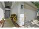 Charming home exterior with a well-manicured lawn, pathway to front door, and two-car garage at 13405 Fawn Springs Dr, Tampa, FL 33626