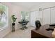 Bright office featuring a piano, a desk and a large window at 13405 Fawn Springs Dr, Tampa, FL 33626