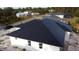 Aerial view of newly constructed home with a Tesla Solar Roof, showcasing modern design at 2551 Alhaven Ter, North Port, FL 34286