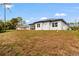 Home exterior with a well-kept lawn and beautiful views at 2551 Alhaven Ter, North Port, FL 34286