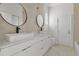 Modern bathroom featuring a double vanity with square vessel sinks and sleek black faucets at 2551 Alhaven Ter, North Port, FL 34286