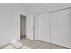Bright bedroom featuring light wood-look floors and a spacious closet for ample storage at 2551 Alhaven Ter, North Port, FL 34286