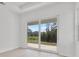 Bright bedroom with large sliding glass doors and view of the backyard at 2551 Alhaven Ter, North Port, FL 34286