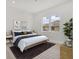 Nicely decorated bedroom features art and windows with a view at 2551 Alhaven Ter, North Port, FL 34286