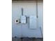 Exterior view of new home featuring the electric panels and conduits on a white stucco wall at 2551 Alhaven Ter, North Port, FL 34286